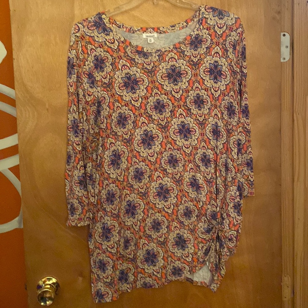 3/4 sleeve pullover top in a blue, salmon and cream print.